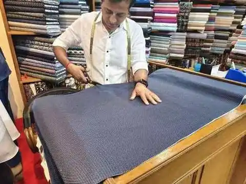 Paul selecting fabric in the Chaweng workshop