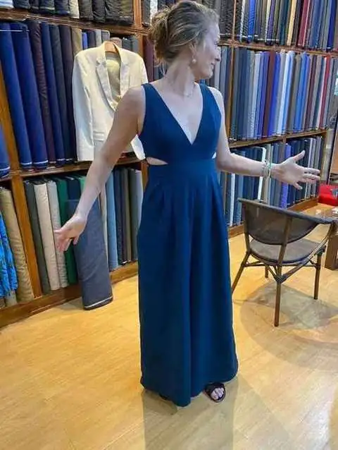 Client in navy blue v-neck evening gown