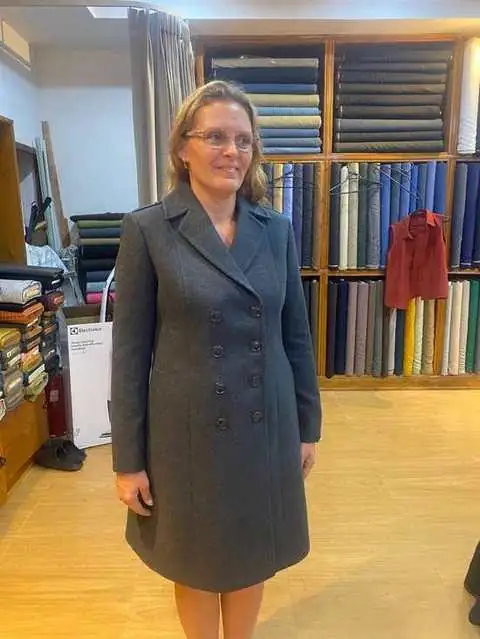 Client in charcoal grey double-breasted wool coat