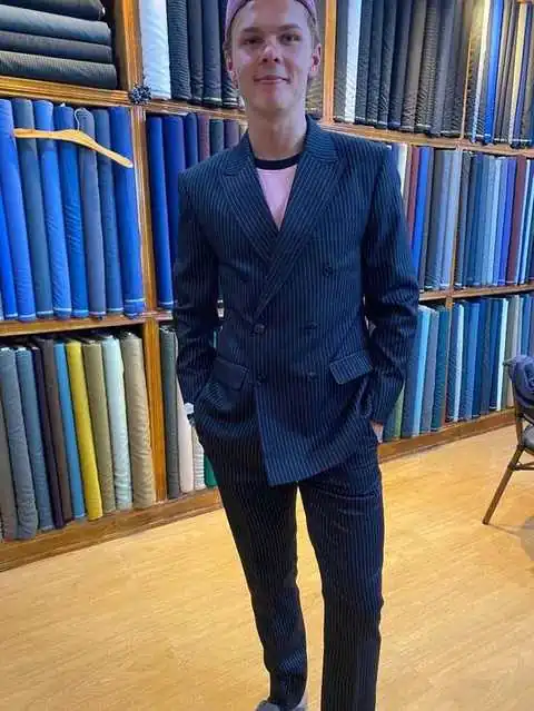 Client in navy pinstripe double-breasted suit